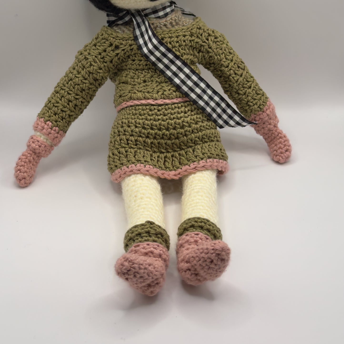 Crochet Doll with Black Hair, Green Sweater and Skirt with Pink Accents