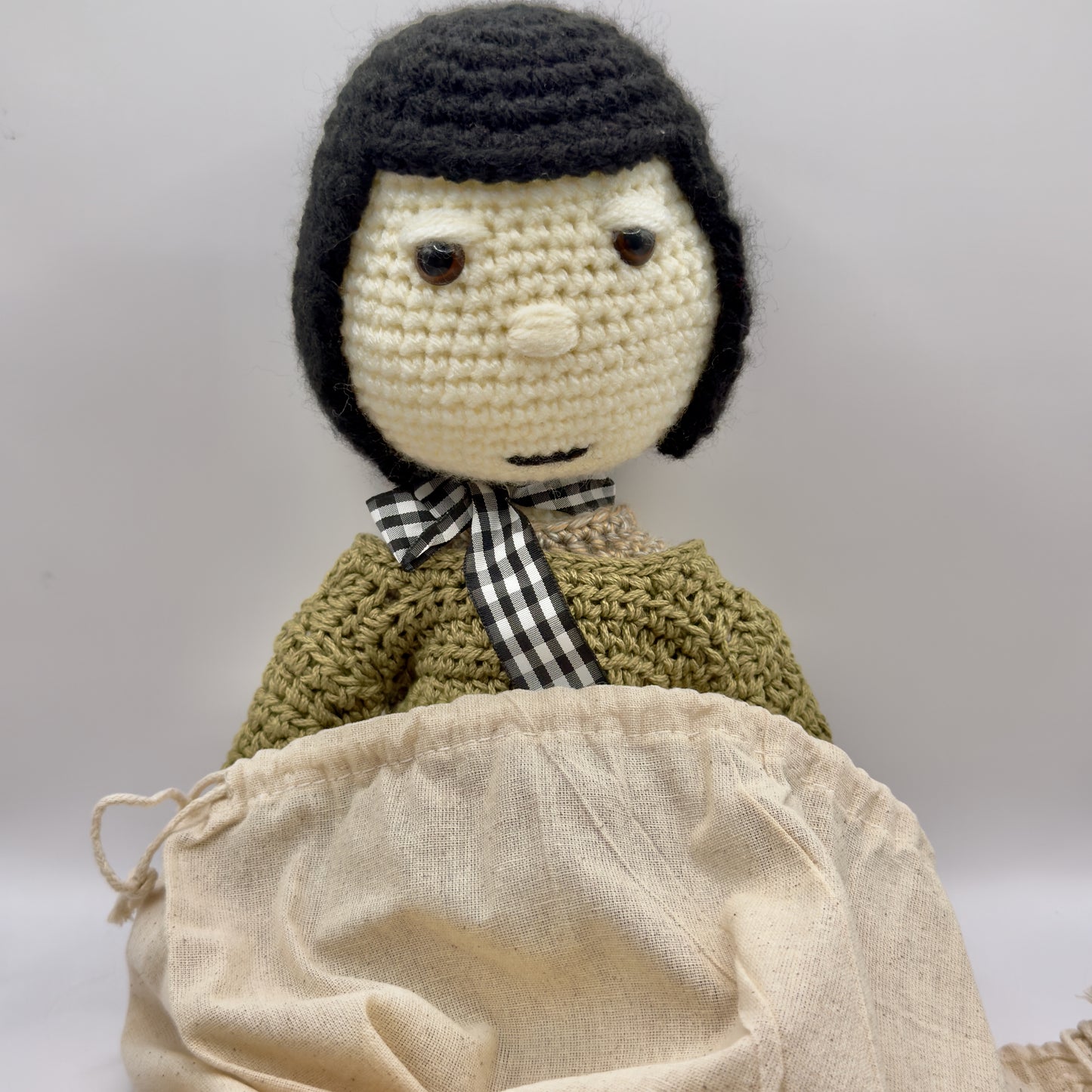 Crochet Doll with Black Hair, Green Sweater and Skirt with Pink Accents